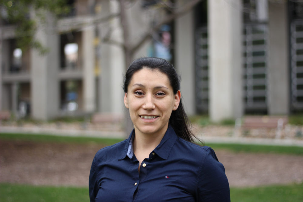 Maria Andrade smiles in photo on UCSD campus.