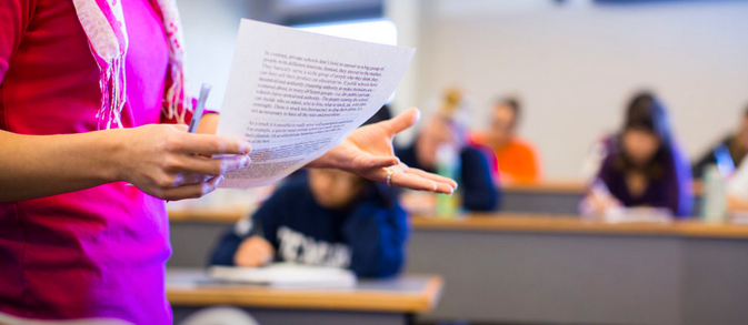 Woman teaching students