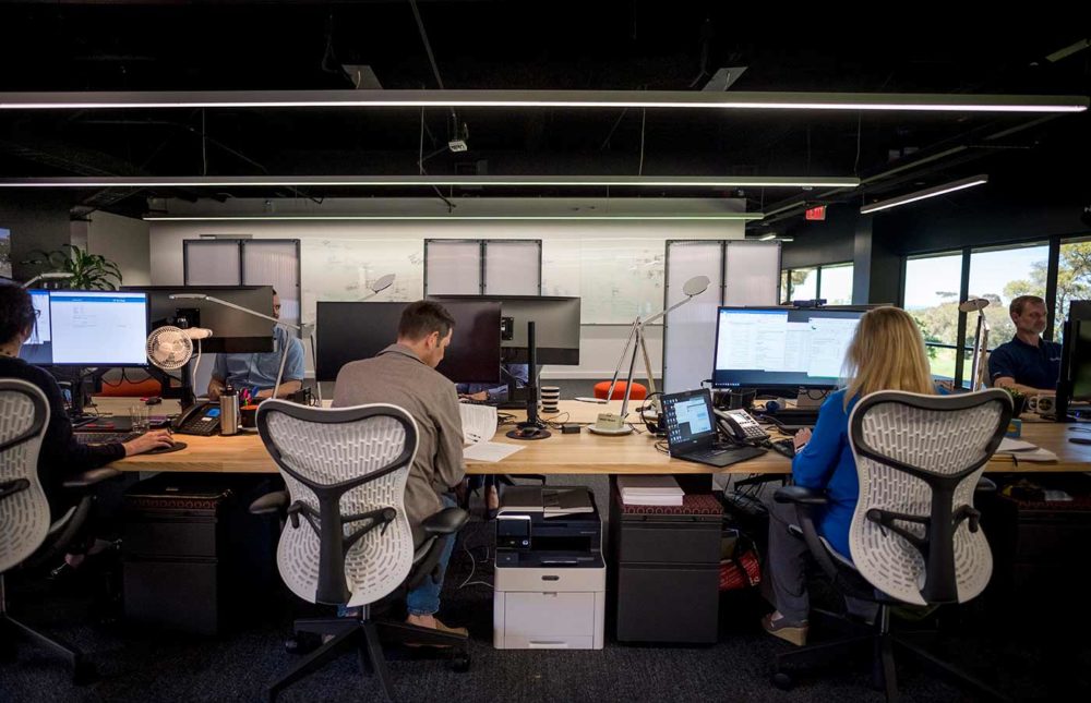 People working on computers at the Hub at UCSD