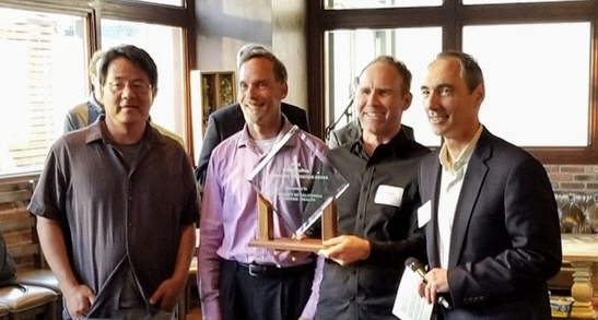 Tom Andriola, UC CIO, poses with a team from UCSD while presenting them with their UC IT Innovation Award - presented by Cisco & ePlus.