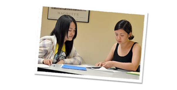 Two young women studying at a table