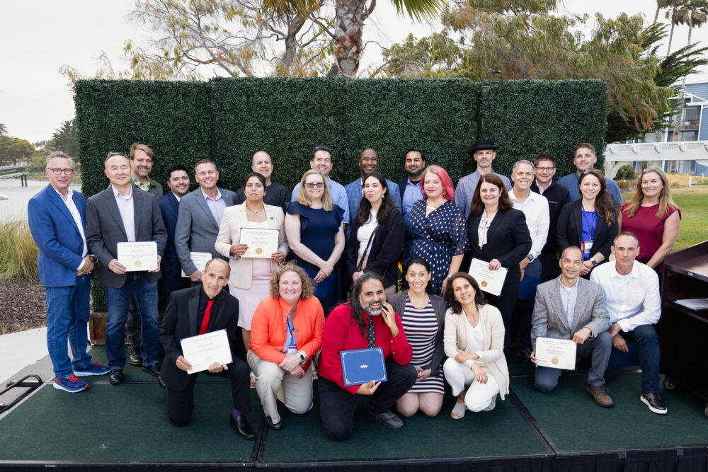 Over 14 winners standing outside at the UC Tech Awards Ceremony