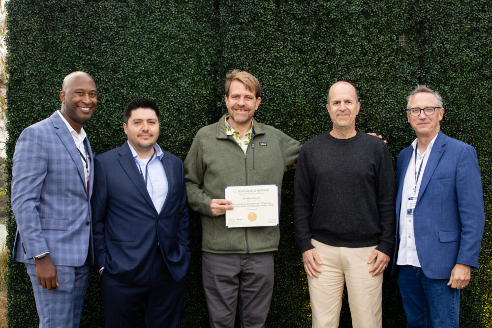 Tom Trappler and David Wilson accepting the UC Tech Yvonne Tevis UC-wide Collaboration golden award presesnted by Van Williams, Gabriel Gonzales, and Joe Bengfort