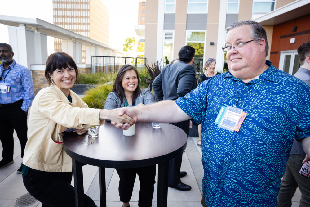 Shaking hands at conference