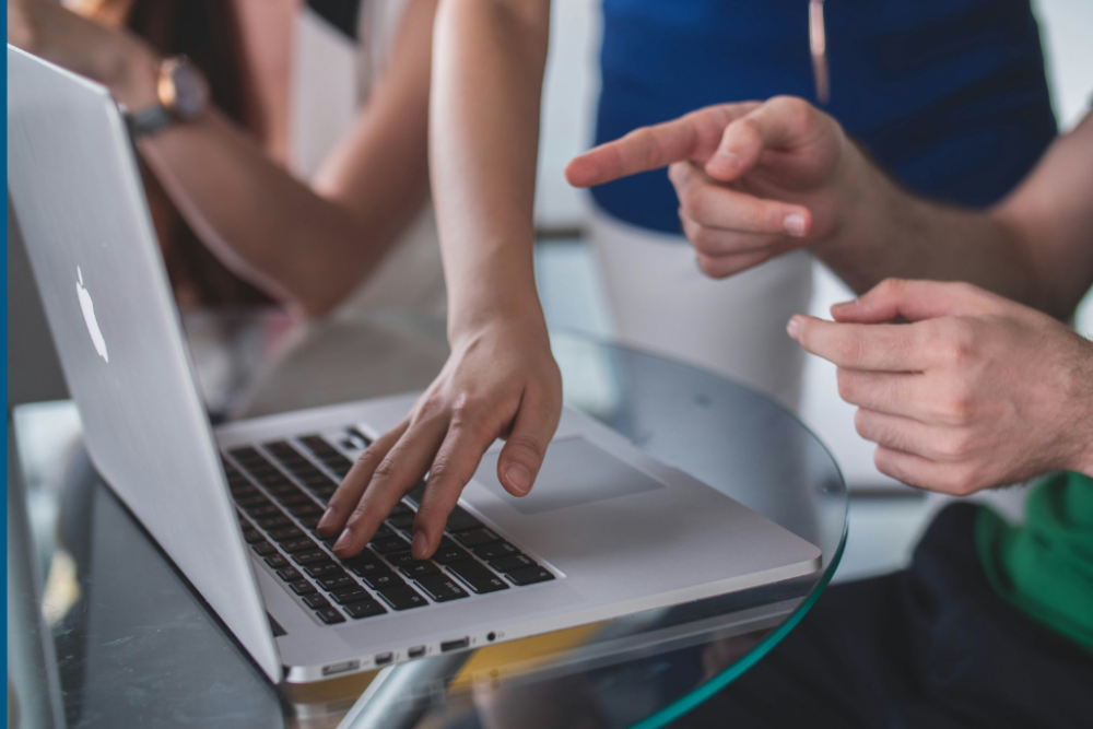 Hands on a laptop keyboard