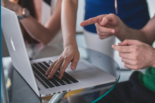 Hands on a laptop keyboard