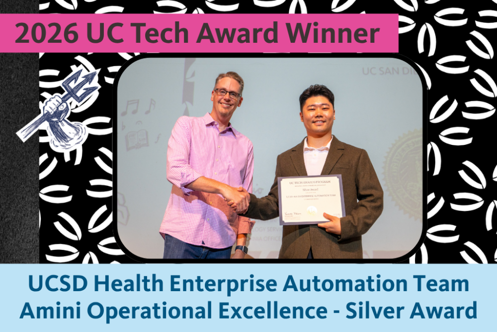 UCSD Health Enterprise Automation team representative, Zammy Wang, holds the Silver Mojgan A. Amini Operational Excellence Award certificate and poses for a photo with UC Merced CIO Nick Dugan.